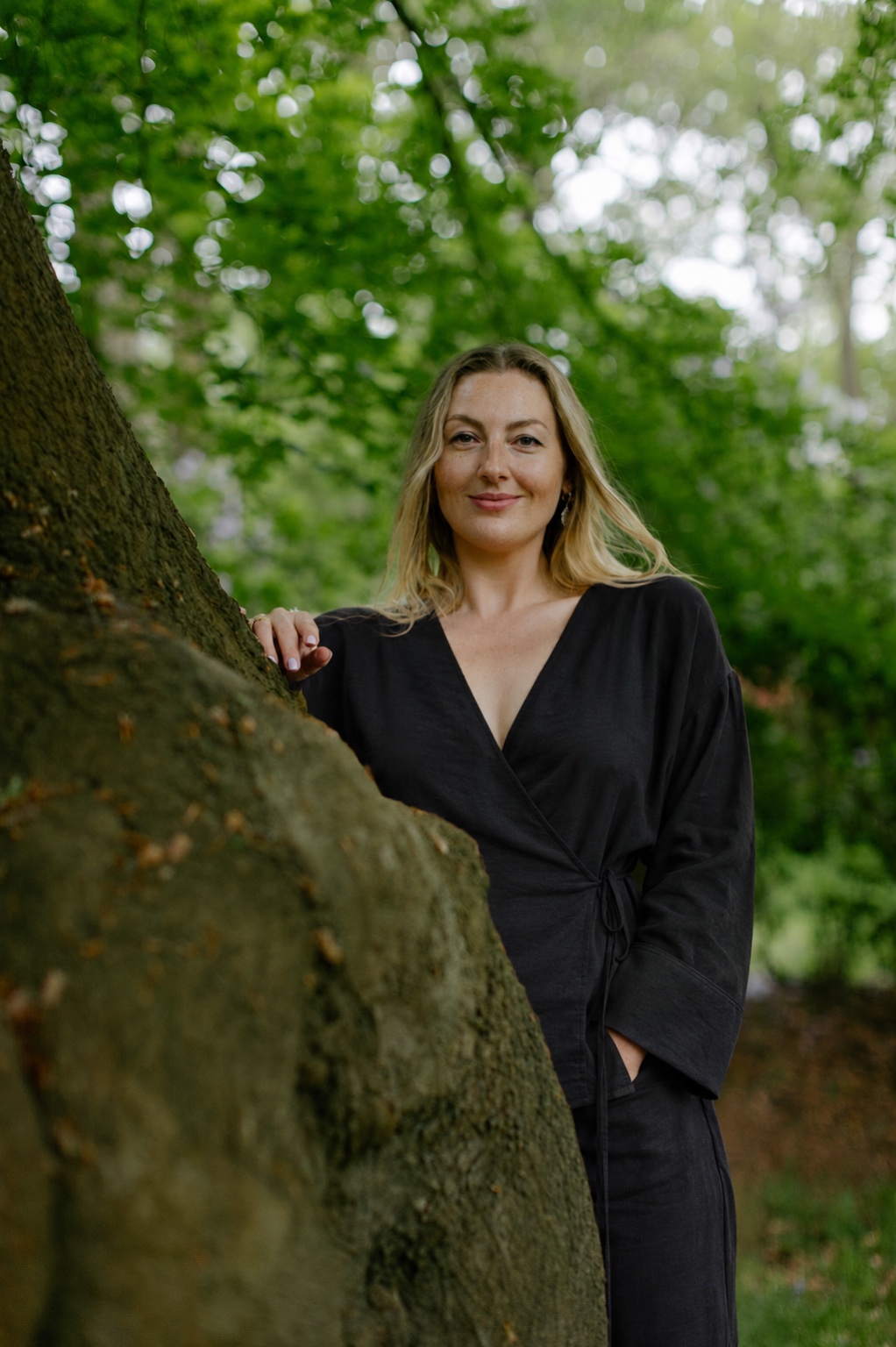 Linda Prigarska in a black jumpsuit in the forest