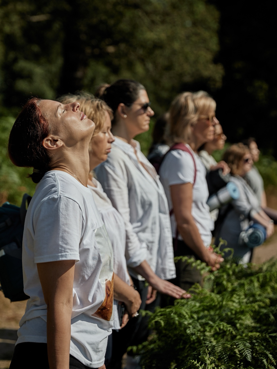 Participants standing with eyes closed during a sensory invitation